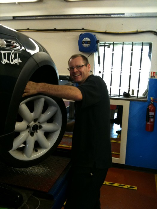 mechanic checking car